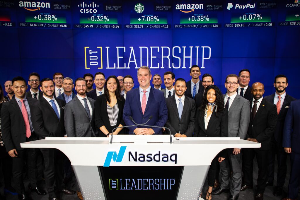 Out Leadership rings the Nasdaq opening bell, with a large group gathered at the podium